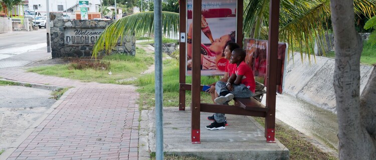Boys at busstop on St. Maarten