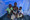 Lorenza Sulemane (23) zit met baby Sulemane (10 maanden), zoon Yezezu (8) en dochter Enesh (6) onder een van UNICEF gekregen muskietennet in Beira, Mozambique.